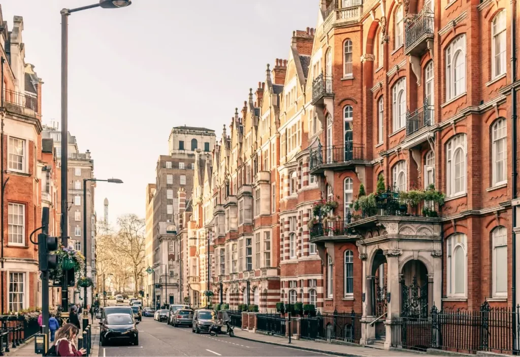 View of red brick and white trim row houses in London, England 