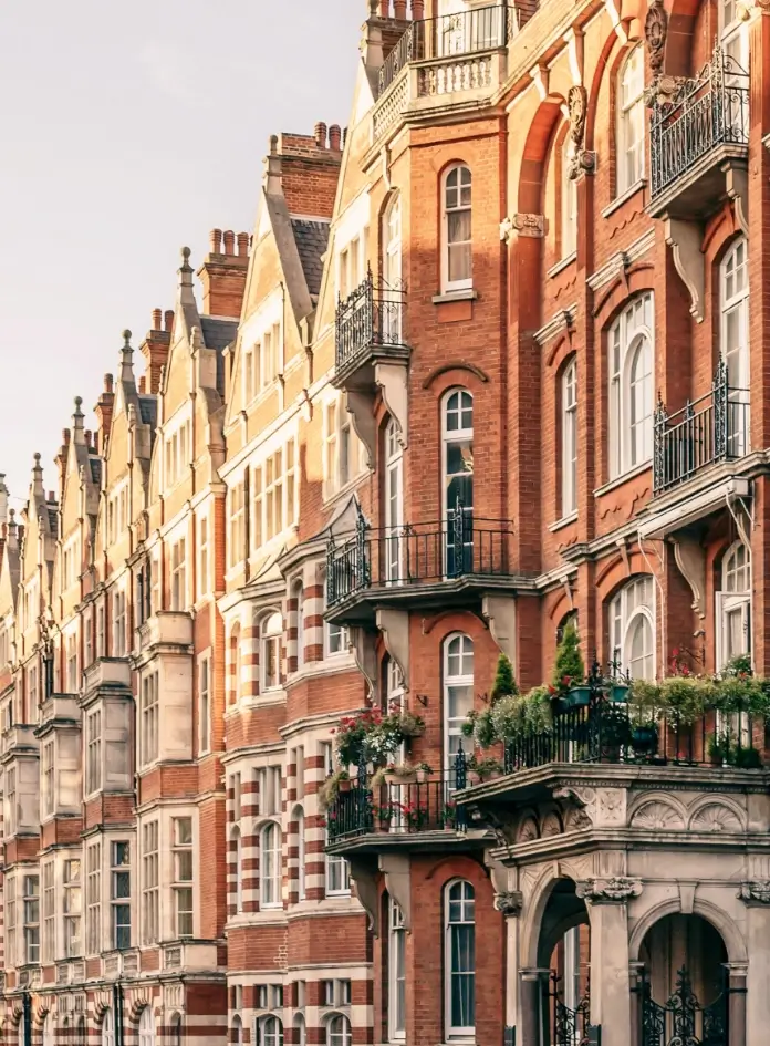View of red brick and white trim row houses in London, England